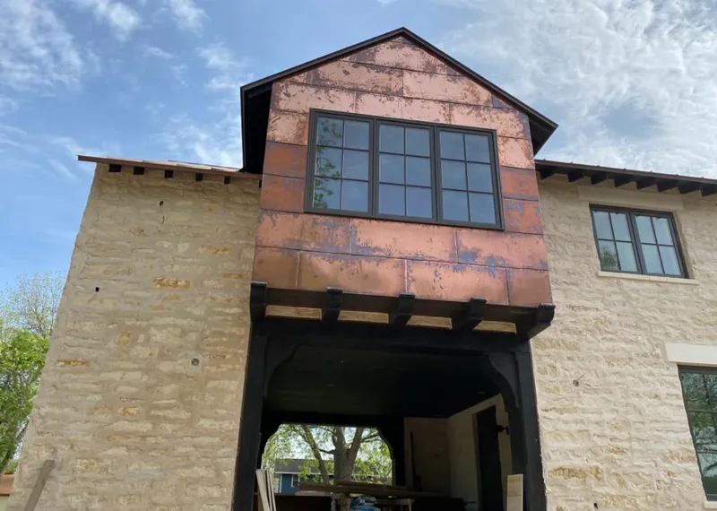 Copper metal panel facade on a stone building for Skylight Installation in Weatherford